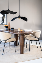 Chaise de salle à manger moderne courbée en tissu rembourré avec cadre en métal noir