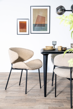 Chaise de salle à manger moderne courbée en tissu rembourré avec cadre en métal noir